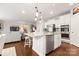 Bright and airy kitchen with a large island, stainless steel appliances, and a seamless connection to the living area at 1467 Tranquility Blvd, Lancaster, SC 29720