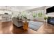 Open-concept space with hardwood floors, plush seating, a fireplace, and seamless flow to the kitchen at 1467 Tranquility Blvd, Lancaster, SC 29720