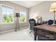 Well-lit office with a large desk, comfortable chair, and bright windows at 1467 Tranquility Blvd, Lancaster, SC 29720