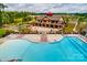 Aerial view of a community clubhouse and pool with lounge chairs, tables and bocce ball courts at 1467 Tranquility Blvd, Lancaster, SC 29720
