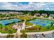 Aerial view of community tennis courts, gazebo, manicured grounds, parking and neighborhood at 1467 Tranquility Blvd, Lancaster, SC 29720