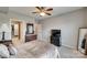 Bedroom featuring a ceiling fan, dresser, and a glimpse into a walk-in closet with custom shelving at 14979 Santa Lucia Dr # 2408, Charlotte, NC 28277