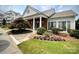 Welcoming clubhouse exterior featuring manicured landscaping and elegant architectural details at 14979 Santa Lucia Dr # 2408, Charlotte, NC 28277