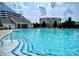 Large community pool with ample seating and a clubhouse, perfect for relaxation at 14979 Santa Lucia Dr # 2408, Charlotte, NC 28277