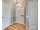 Bright entryway featuring multiple doors and wood-style flooring at 14979 Santa Lucia Dr # 2408, Charlotte, NC 28277