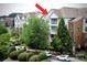 Condominium complex shows well-maintained facade, manicured landscape, and ample parking at 14979 Santa Lucia Dr # 2408, Charlotte, NC 28277