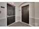 Hallway with unit door and fire exit door at 14979 Santa Lucia Dr # 2408, Charlotte, NC 28277