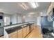 Open concept kitchen featuring granite countertops, stainless steel appliances, and hardwood floors at 14979 Santa Lucia Dr # 2408, Charlotte, NC 28277