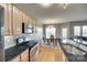 Well-lit kitchen featuring granite countertops, stainless steel appliances and dining area at 14979 Santa Lucia Dr # 2408, Charlotte, NC 28277