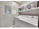 Laundry room with washer, dryer, and overhead storage at 14979 Santa Lucia Dr # 2408, Charlotte, NC 28277