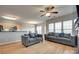 Spacious living room features hardwood floors and comfortable gray sofas at 14979 Santa Lucia Dr # 2408, Charlotte, NC 28277