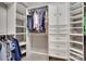 Spacious walk-in closet with custom shelving and ample storage at 14979 Santa Lucia Dr # 2408, Charlotte, NC 28277