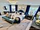 Stylish bedroom with neutral walls, carpet, modern lighting and decor with natural light from 2 windows at 1510 Old Rivers Rd # 171, Concord, NC 28027