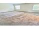 Sunlit bedroom with 2 windows offers soft carpet at 1510 Old Rivers Rd # 171, Concord, NC 28027