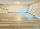 Upstairs bonus room with neutral walls and natural light from 2 windows and a sliding glass door at 1510 Old Rivers Rd # 171, Concord, NC 28027