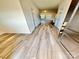 Welcoming entryway boasting wood-look flooring and a view into the open-concept living space at 1510 Old Rivers Rd # 171, Concord, NC 28027