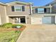 Charming home featuring a grey exterior, black shutters, and a well-maintained lawn at 1510 Old Rivers Rd # 171, Concord, NC 28027