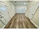 Hallway showcasing wood-look floors connecting various rooms in the home at 1510 Old Rivers Rd # 171, Concord, NC 28027