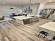 Open kitchen with a large island, stainless steel appliances, and modern light fixtures at 1510 Old Rivers Rd # 171, Concord, NC 28027