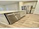 Modern kitchen island with stainless steel dishwasher and view of the stainless steel refrigerator at 1510 Old Rivers Rd # 171, Concord, NC 28027