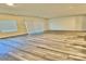 Bright living area featuring luxury vinyl plank floors, neutral walls, and multiple windows at 1510 Old Rivers Rd # 171, Concord, NC 28027