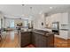 Gourmet kitchen showcasing a spacious island with a gas cooktop and plenty of counter space at 15830 Waterfront Dr, Huntersville, NC 28078