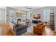 Cozy living room features a fireplace, hardwood floors, neutral paint and plenty of natural light at 15830 Waterfront Dr, Huntersville, NC 28078