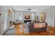 Bright living room boasting hardwood floors, a cozy fireplace, and an open layout at 15830 Waterfront Dr, Huntersville, NC 28078