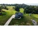 Expansive property featuring a modern home, lush greenery, a long driveway, and storage shed at 164 Vance Farm Dr, Statesville, NC 28625