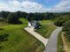 An aerial view of the home showing the driveway and the surrounding green lawn and trees at 164 Vance Farm Dr, Statesville, NC 28625