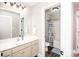 Well-lit bathroom showcasing a vanity with sink and a view into the bathtub area at 164 Vance Farm Dr, Statesville, NC 28625
