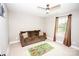 Cozy room with a sofa, ceiling fan, and window providing lots of natural light at 164 Vance Farm Dr, Statesville, NC 28625
