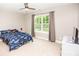 Bright bedroom with a ceiling fan and large window offering scenic views at 164 Vance Farm Dr, Statesville, NC 28625