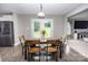 Inviting dining area features wood floors, stylish table, and doors that provide scenic views at 164 Vance Farm Dr, Statesville, NC 28625