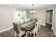 Lovely dining room with hardwood floors, stylish lighting, and a large window with natural light at 164 Vance Farm Dr, Statesville, NC 28625