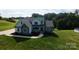 Charming two-story home with stone accents, white siding, and a well-manicured lawn at 164 Vance Farm Dr, Statesville, NC 28625