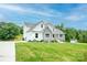 Well-maintained front exterior with stone accents, lush lawn, and a long driveway at 164 Vance Farm Dr, Statesville, NC 28625
