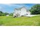 Back of the house with a deck, large yard, and plenty of parking with lawn space at 164 Vance Farm Dr, Statesville, NC 28625