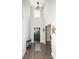Inviting foyer with soaring ceilings, dark wood floors, and stylish black front door and decor at 164 Vance Farm Dr, Statesville, NC 28625