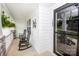 Charming front porch with rocking chairs, hanging plants, and stylish black accents at 164 Vance Farm Dr, Statesville, NC 28625