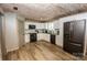 Modern kitchen boasts white cabinets and black appliances at 164 Vance Farm Dr, Statesville, NC 28625