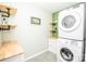 Efficient laundry room includes built in storage, shelving, and modern washer dryer at 164 Vance Farm Dr, Statesville, NC 28625
