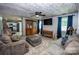 The living room offers plenty of seating and natural light with view to the modern kitchen at 164 Vance Farm Dr, Statesville, NC 28625
