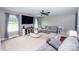 Comfortable living room with neutral décor, large windows, and a contemporary entertainment unit at 164 Vance Farm Dr, Statesville, NC 28625
