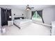Bright bedroom with a decorative ceiling fan, neutral decor, and plenty of light at 164 Vance Farm Dr, Statesville, NC 28625