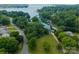 Scenic aerial view of a waterfront property with lush trees and easy access to a calm lake at 20000 Schooner Dr, Cornelius, NC 28031