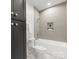 Bathroom with a tub and shower combination, tiled walls, and modern fixtures at 20000 Schooner Dr, Cornelius, NC 28031