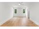 Bedroom with hardwood floors, white trim, and two windows that provide natural light at 20000 Schooner Dr, Cornelius, NC 28031