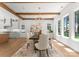 Elegant dining room featuring a wooden table, six chairs, hardwood floors, and a decorative light fixture at 20000 Schooner Dr, Cornelius, NC 28031