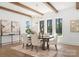 Bright dining room with hardwood floors, a wooden table with six chairs, and natural light from surrounding windows at 20000 Schooner Dr, Cornelius, NC 28031